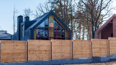 horizontal wooden fence around the house