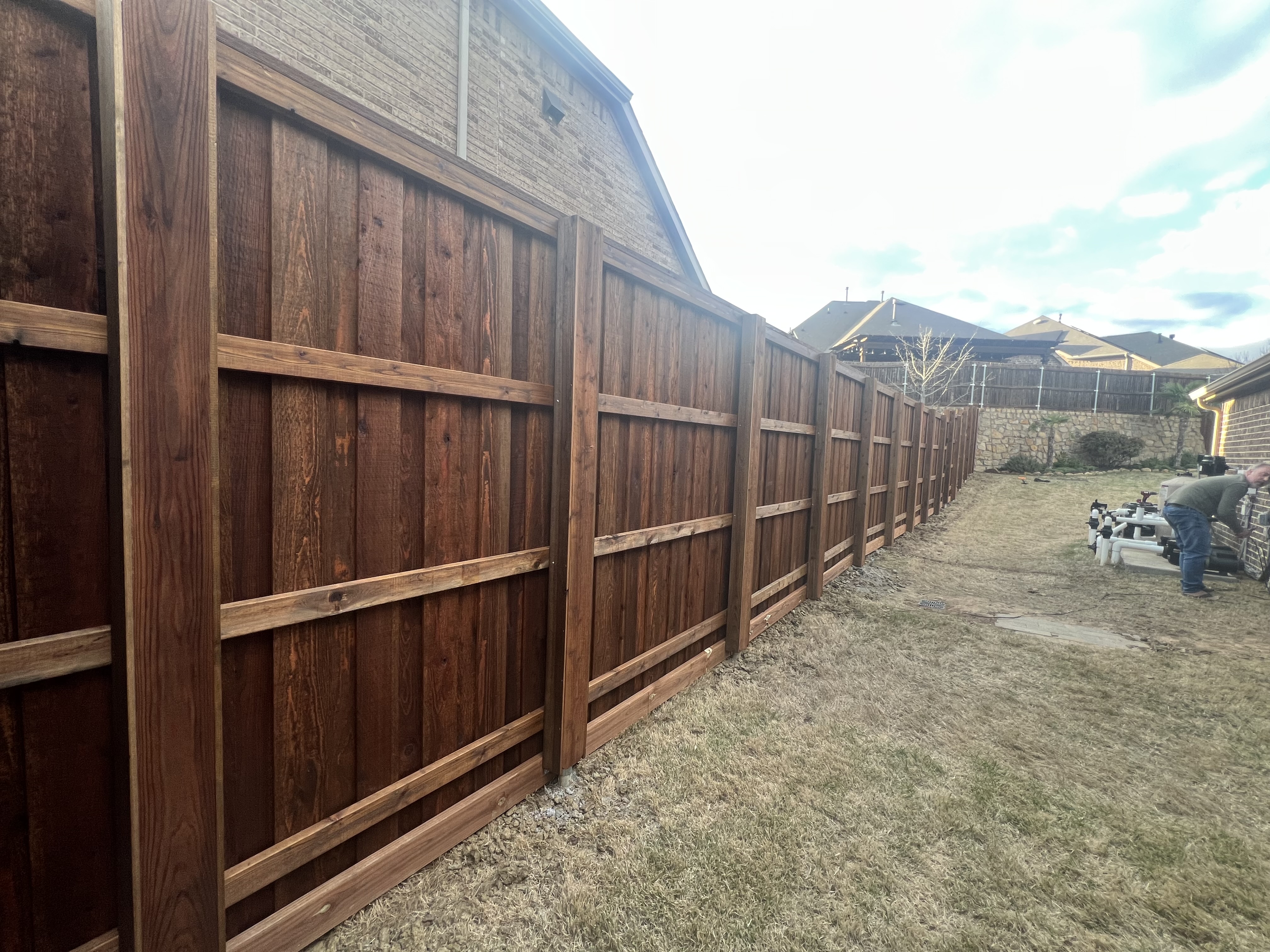 Board on board fence with posts boxed in