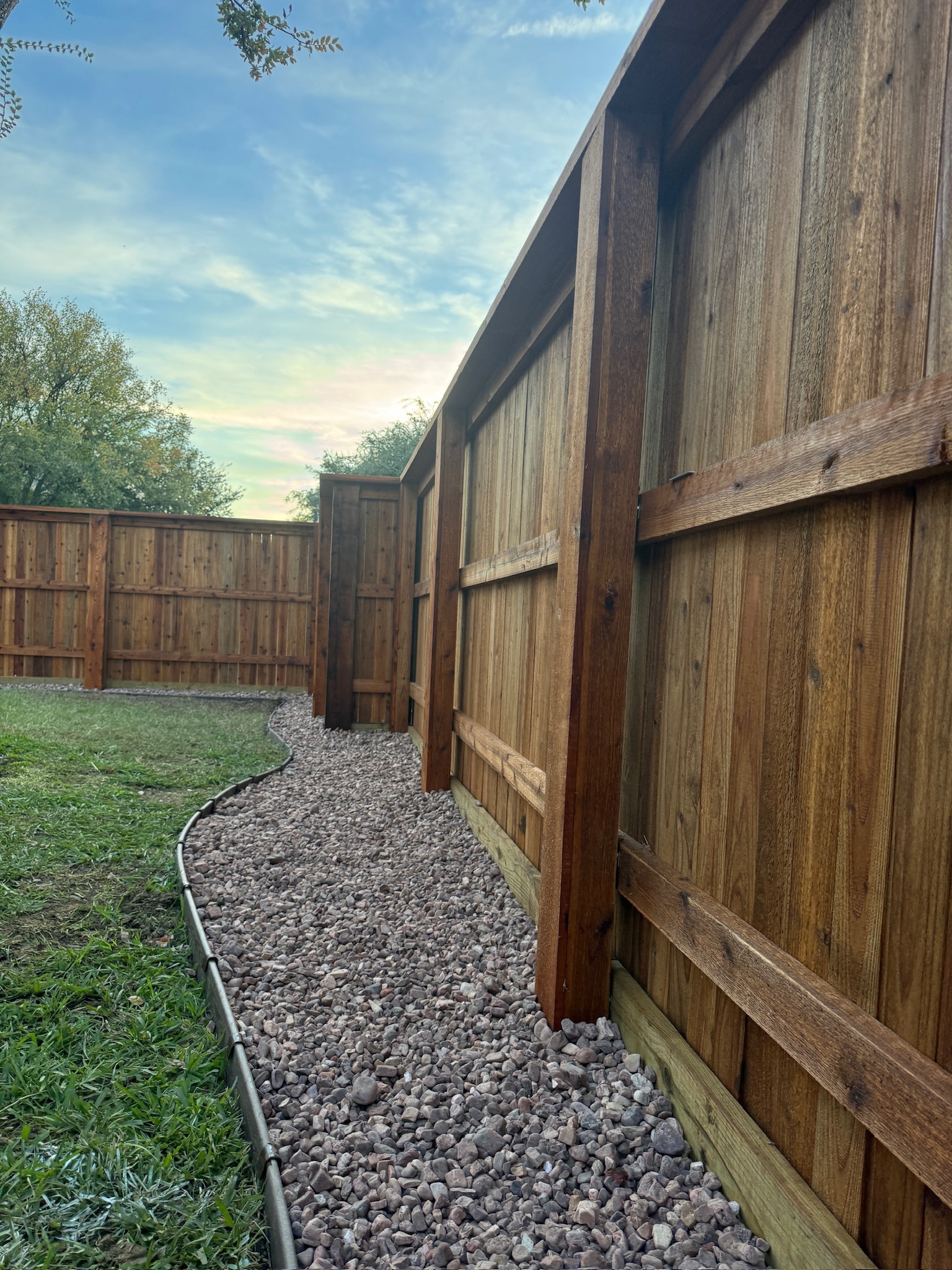 Custom boxed in posts with rock border (Lantana)