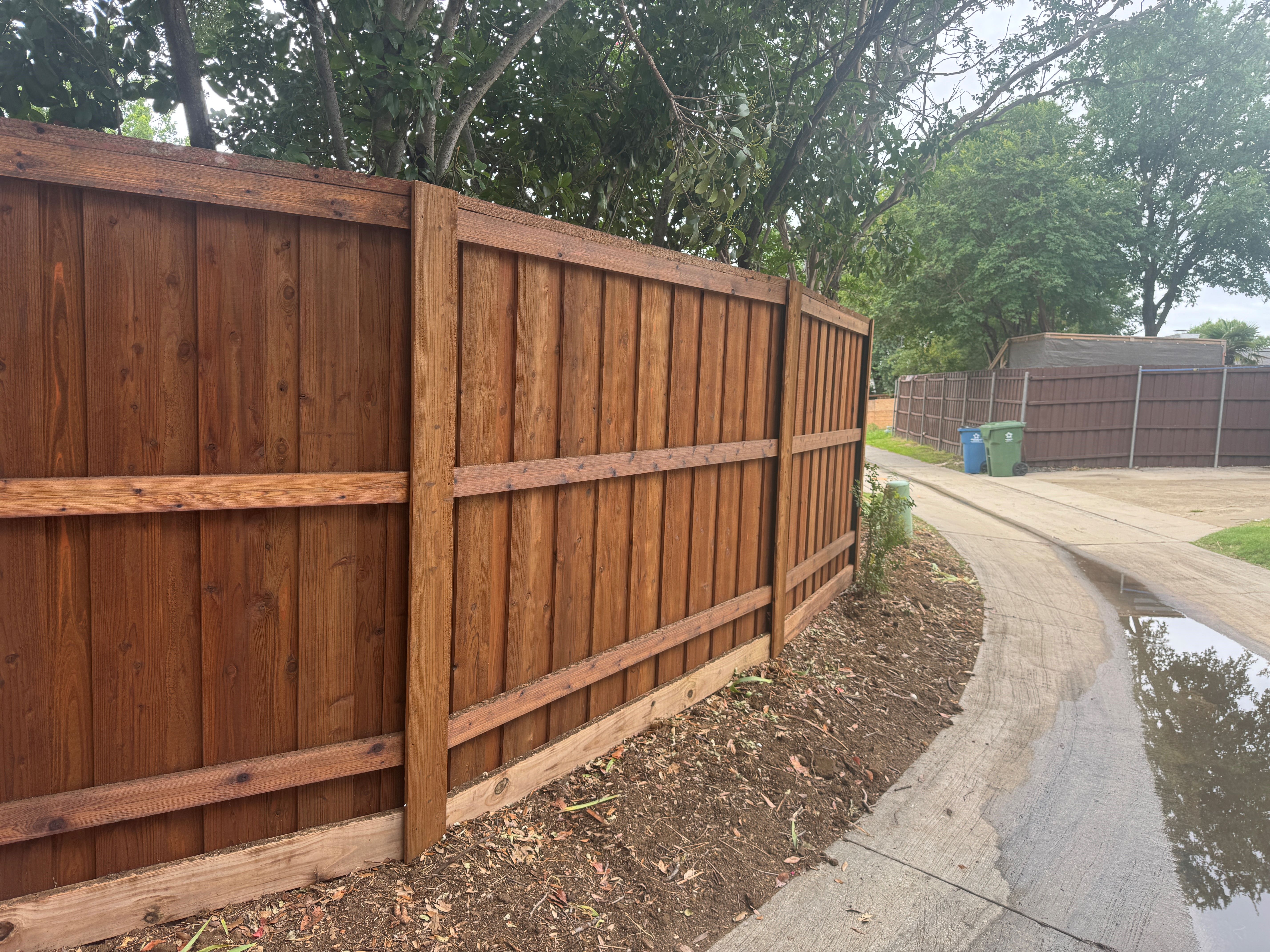 PostMaster+ posts installed on 6' board on board fence with cap and trim in Flower Mound