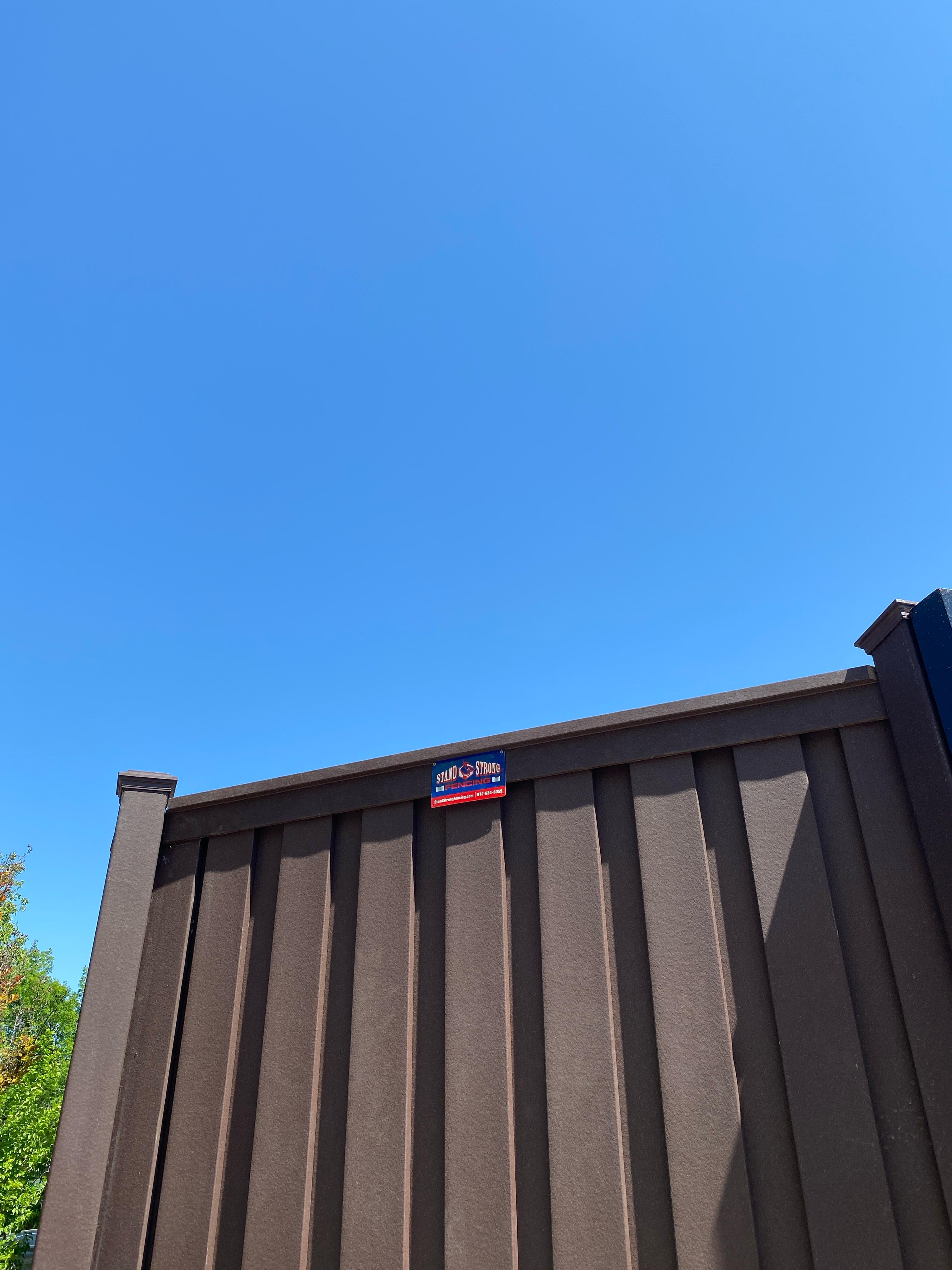 Trex composite fence with a 20 ft automated sliding gate (solar)